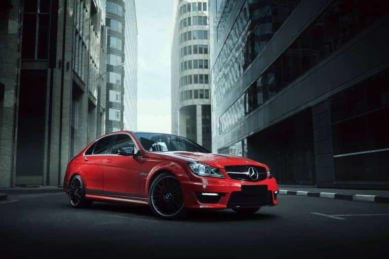 Red car mercedes benz c63 stay on asphalt road in city, How Do I Know If My Mercedes Has Remote Start? [Read This!]
