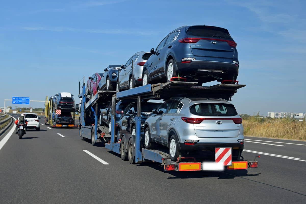 September 18th, 2018: Car transporters driving on the highway. The car transporter on the first plan has 7 Kia Sportage (from Slovak factory) cars on board.