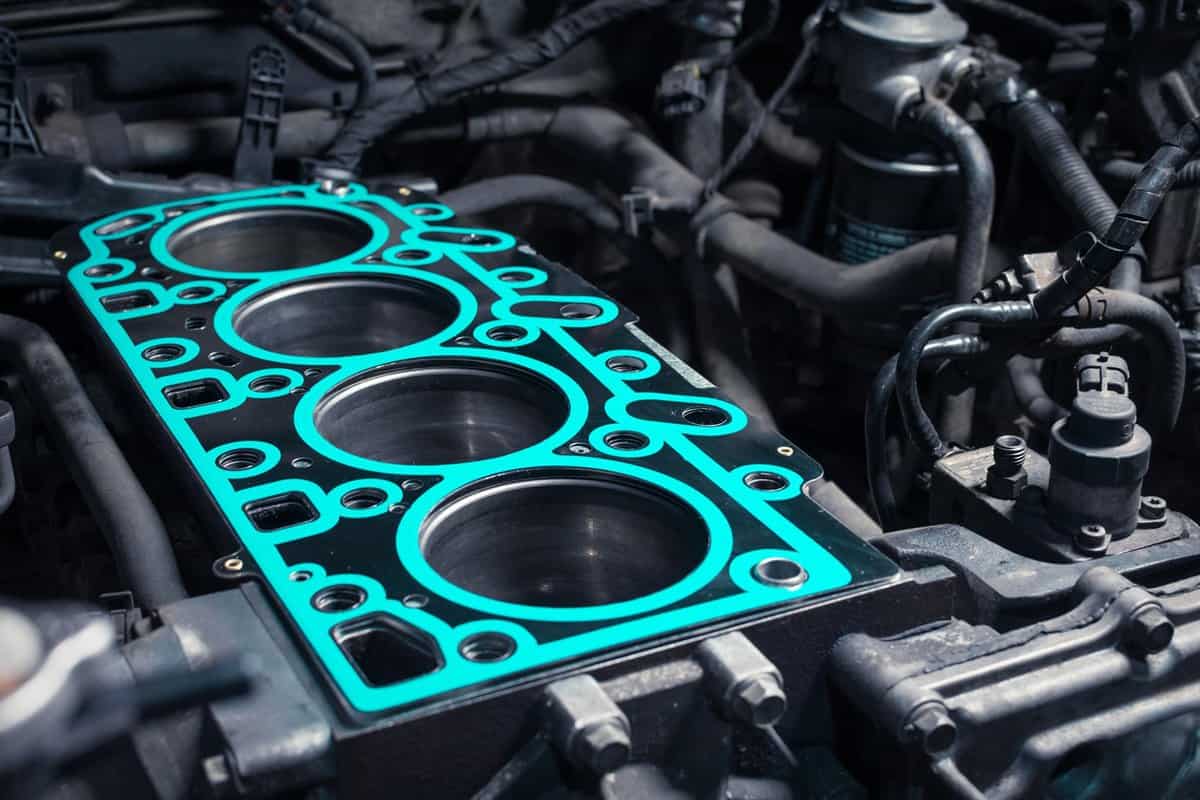 Short block with installed cylinder head gasket. Repair of a turbocharged diesel engine in a car workshop. Close up. Blur effect.