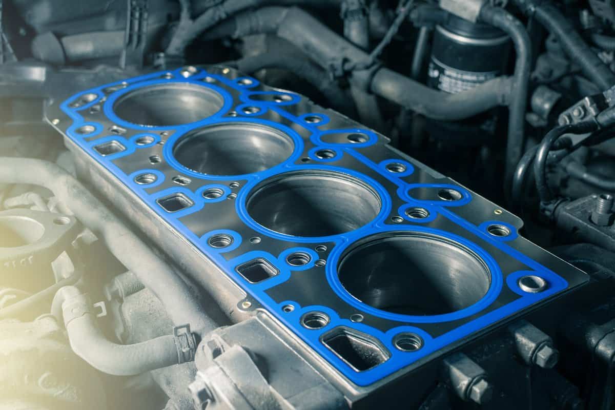 Short block with installed cylinder head gasket. Repair of a turbocharged diesel engine in a car workshop. Close up. Blur effect.