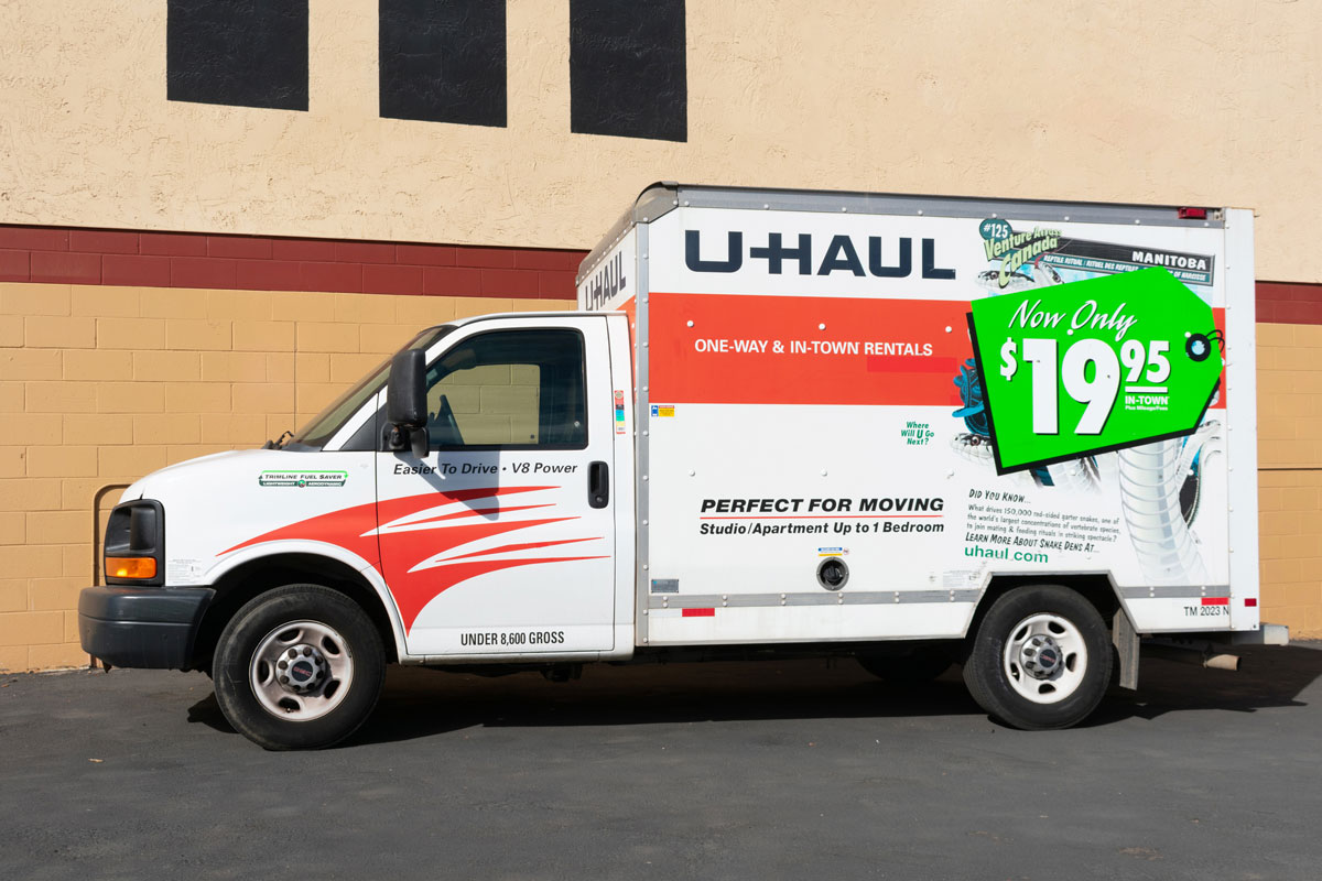 Side view of parked U-Haul 10 ft moving truck