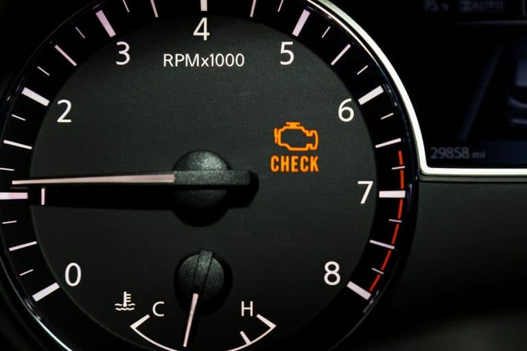 check-engine-light-illuminated-on-dashboard, What Does A Check Engine Light With A Down Arrow Mean?
