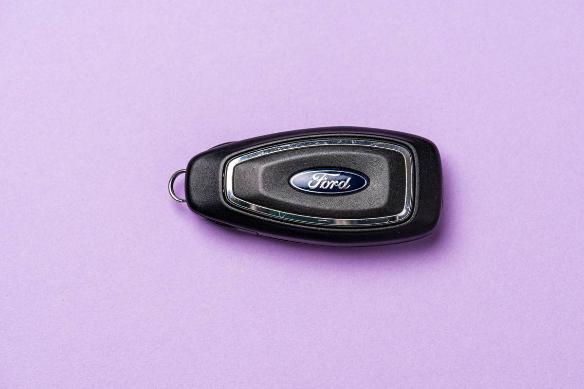 A Ford car key fob on a table.