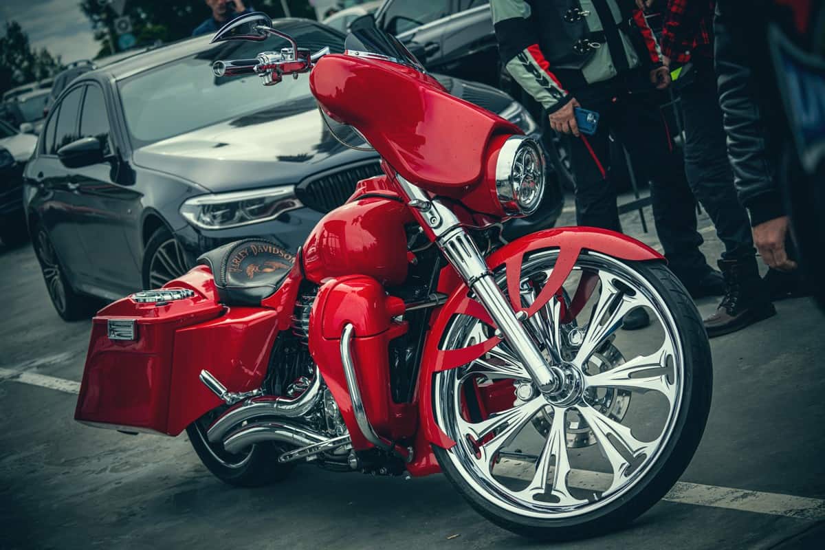 A red colored Harley Davidson at a meet up