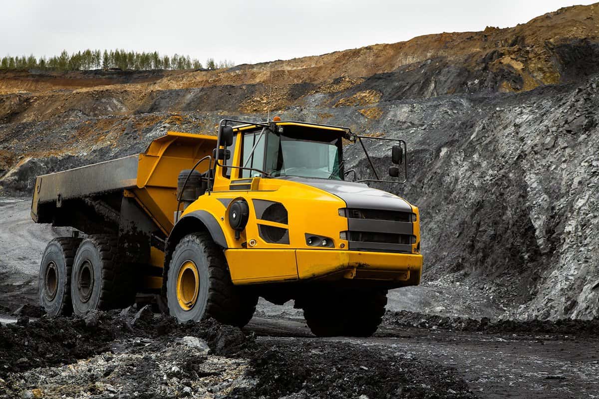 Articulated dump truck on the road in an open coal mine