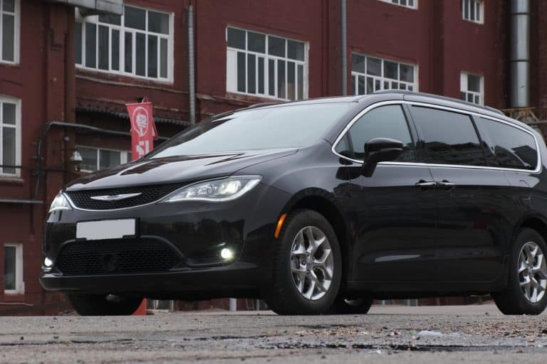 Black minivan chrysler pacifica 2020 model on parking lot from side front., Chrysler Pacifica Emergency Brake Is Stuck - How To Release It