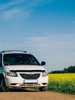 Chrysler Voyager in summer meadow landscape. on the background of yellow field, Why Is My Chrysler Voyager Central Locking Not Working?