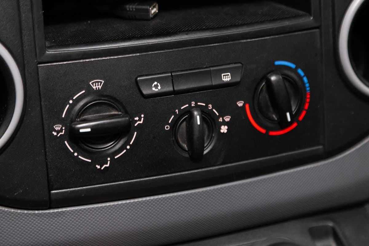 Citroen Berlingo, Close up Instrument automobile panel with climat control view with air conditioning buttons- details and controls of modern car.