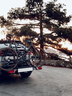 Crossover car with two road bicycles loaded on a rack - How To Remove Bike Rack From Car [Inc. Thule, Yakima, And Allen]