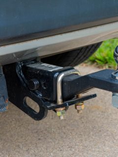 Hitch and ball on the back of an SUV, How To Keep Trailer Hitch From Rattling