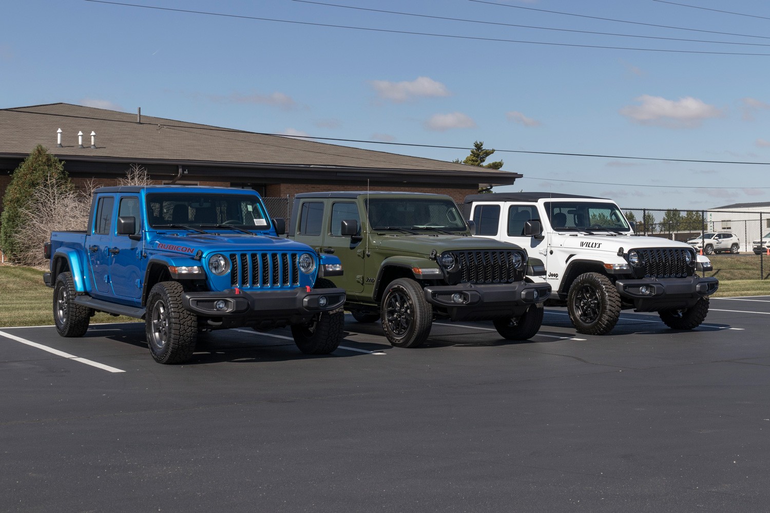 Jeep Gladiator display at a Stellantis dealer. The Jeep Gladiator models include the Sport, Willys, Rubicon and Mojave.