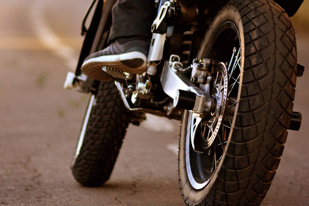 Motorcycle with biker on the asphalt road