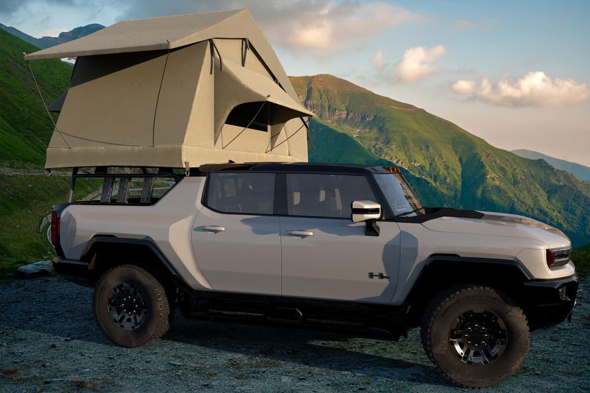 NEW GMC HUMMER EV - electric pickup with power over 1000 horsepower adapted as Camper with a tent.3D illustration.