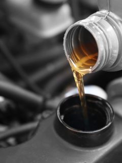 Pouring oil to car engine, close up, What Is The Best Oil For A Predator 212