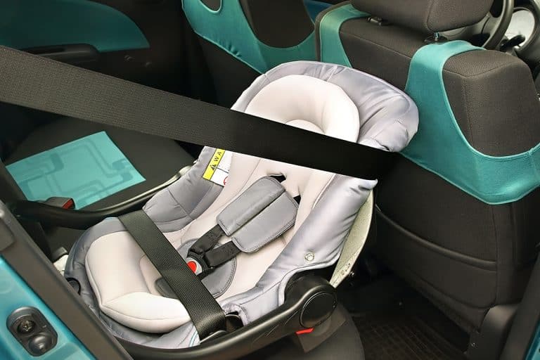 Rear-facing baby seat properly installed in compact car, My Child's Car Seat Keeps Sliding! - Why? What To Do?