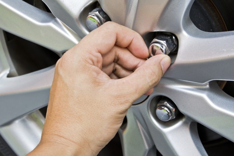 Replacing lug nuts by hand while changing tires on a vehicle, Is It Safe To Drive With A Missing Lug Nut? [Here's What You Need To Know!]