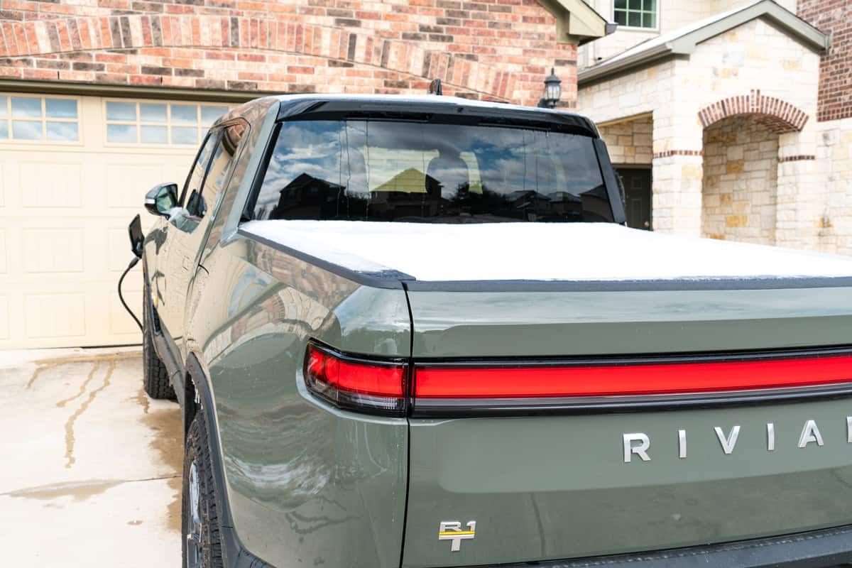  Rivian Pick Up Truck Covered in Ice and Snow while Charging at home a great outdoor adventure Electric Pick Up Truck