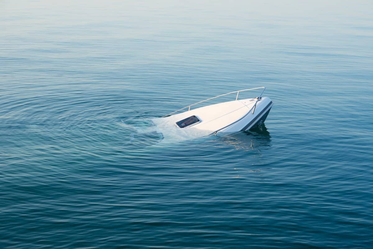Sinking modern large white boat goes underwater 