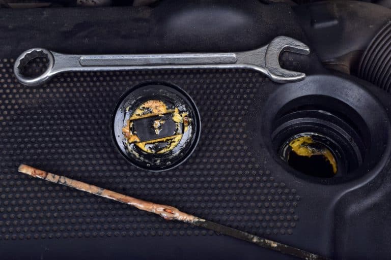 The thick, greasy yellow motor oil under oil cap as signs and symptom of a blown head gasket. Broken a car, What Does A Blown Head Gasket Sound Like? Here's What You Should Know!