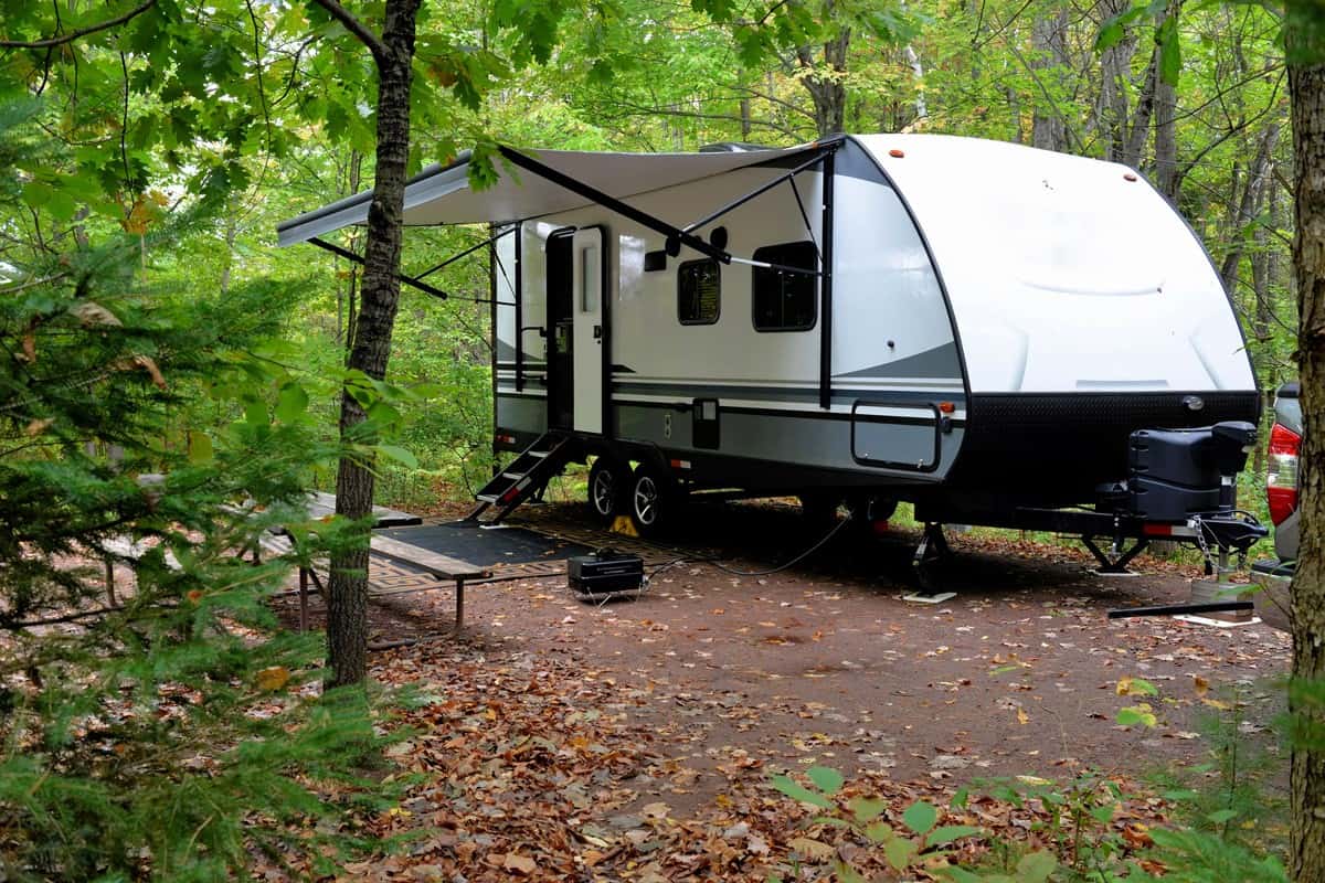 Travel trailer camping in the woods.