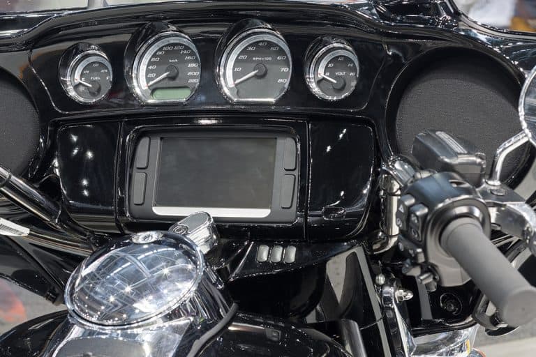 Wide set handlebar of motorcycle with display screen, Why Does My Harley Davidson Say Enter Pin? What To Do?