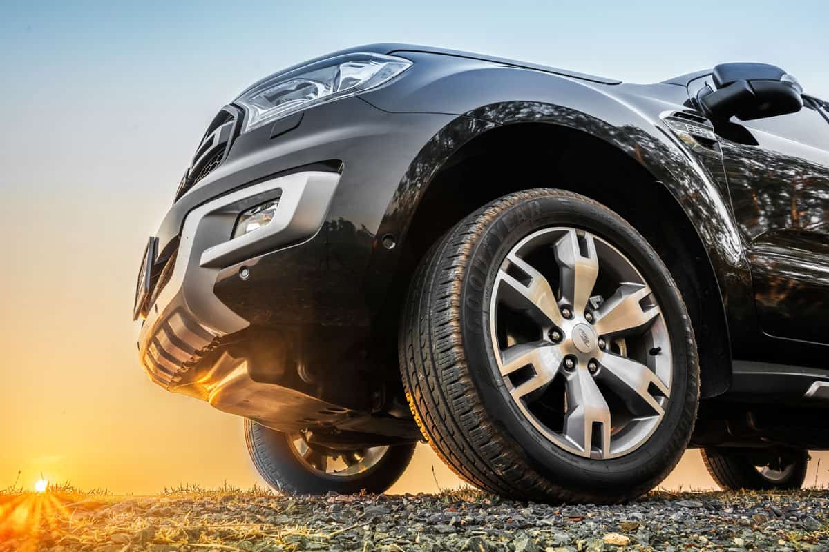 brand new ford everest close up tire and mags on a sunny dessert