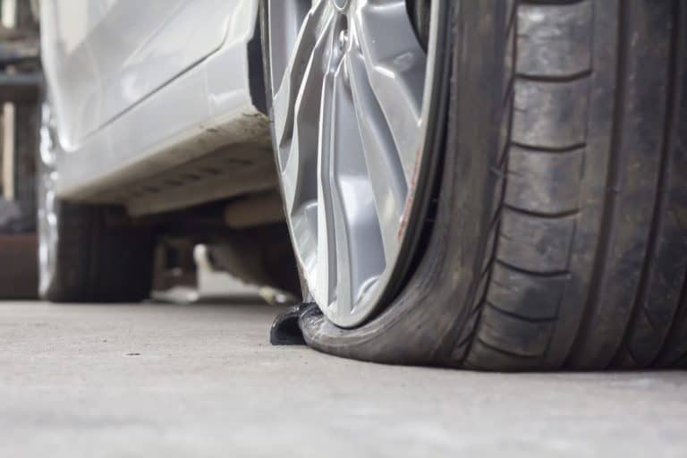 burst flat tire of a car vehicle wheel silver paint sedan, How Long Can A Car Sit On A Flat Tire?