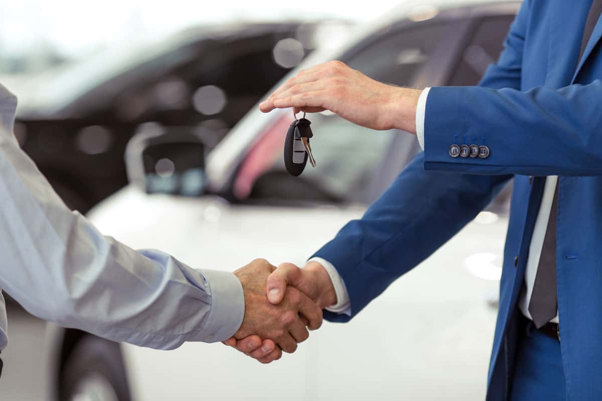 handshake two businessmen when selling car