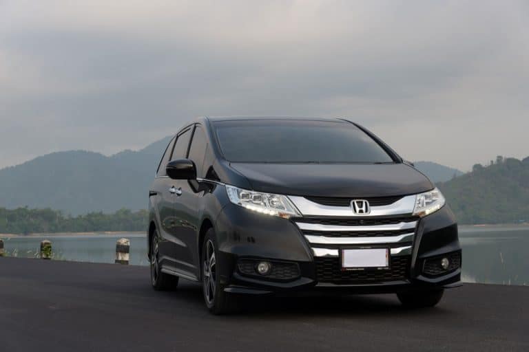 honda odyssey glossy metallic black captured on road, How To Open Hood On Honda Odyssey [Quickly & Easily]