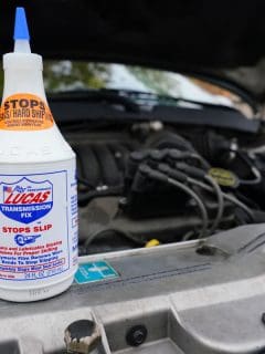 Lucas oil transmission fix stops slip and leaks bottle on the top of the engine bay, How To Use Lucas Oil Stop Leak
