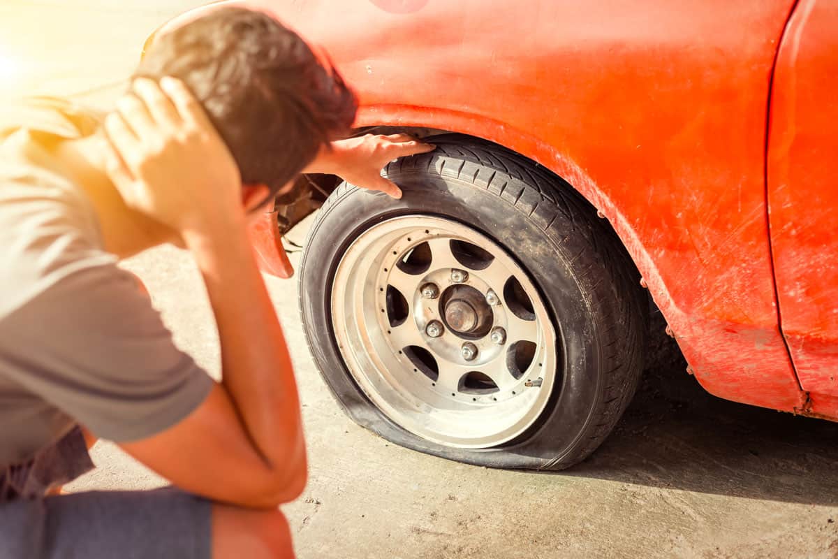 man headache when car breakdown wheel