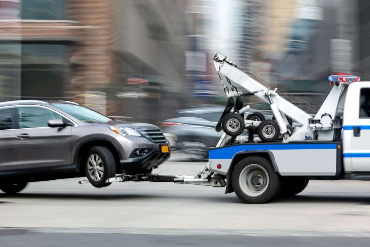 police department tow truck delivers the damaged vehicle