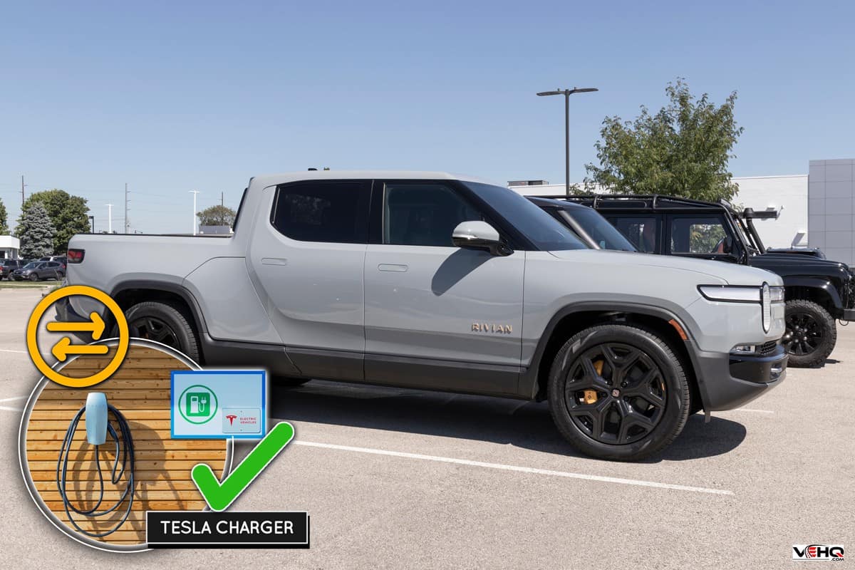 Can Rivian Drivers Use Tesla Chargers?, Rivian R1T Pickup Truck display at a dealership. Rivian offers the R1T in Explore, Adventure and Launch models.