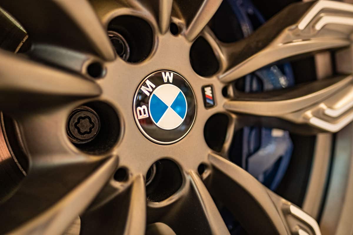 A closeup of BMW alloy wheel on brand new showroom 7 series model