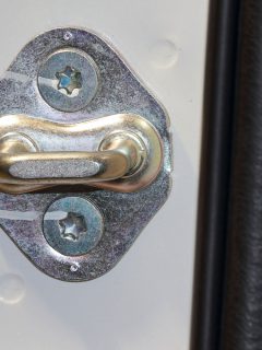 Close up of car door striker, How To Adjust A Tailgate Striker