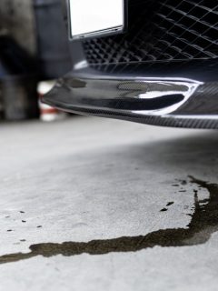 Engine oil stains of car Leak under the car when the car is park In the garage service floor photo concept for check and maintenance, How To Use Blue Devil Oil Stop Leak