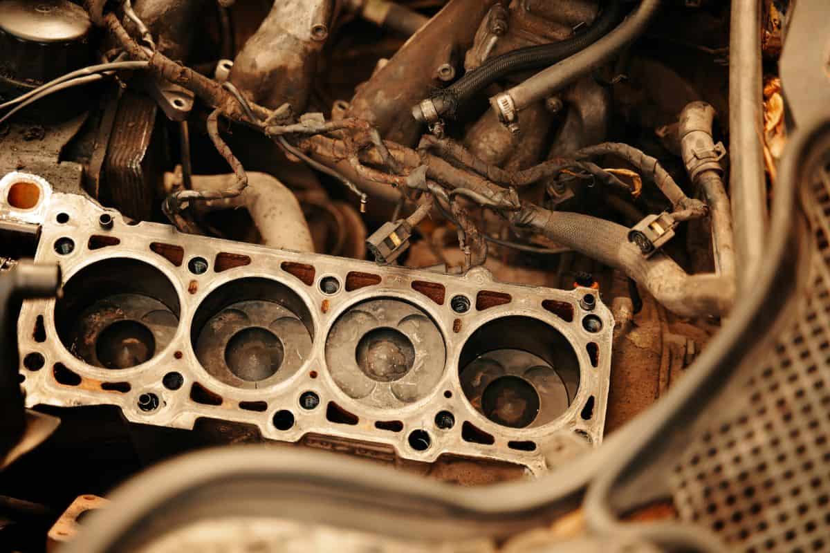 Engine repair. cylinder head gasket replacement in the workshop . Maintenance repair at car service station for diagnosis.