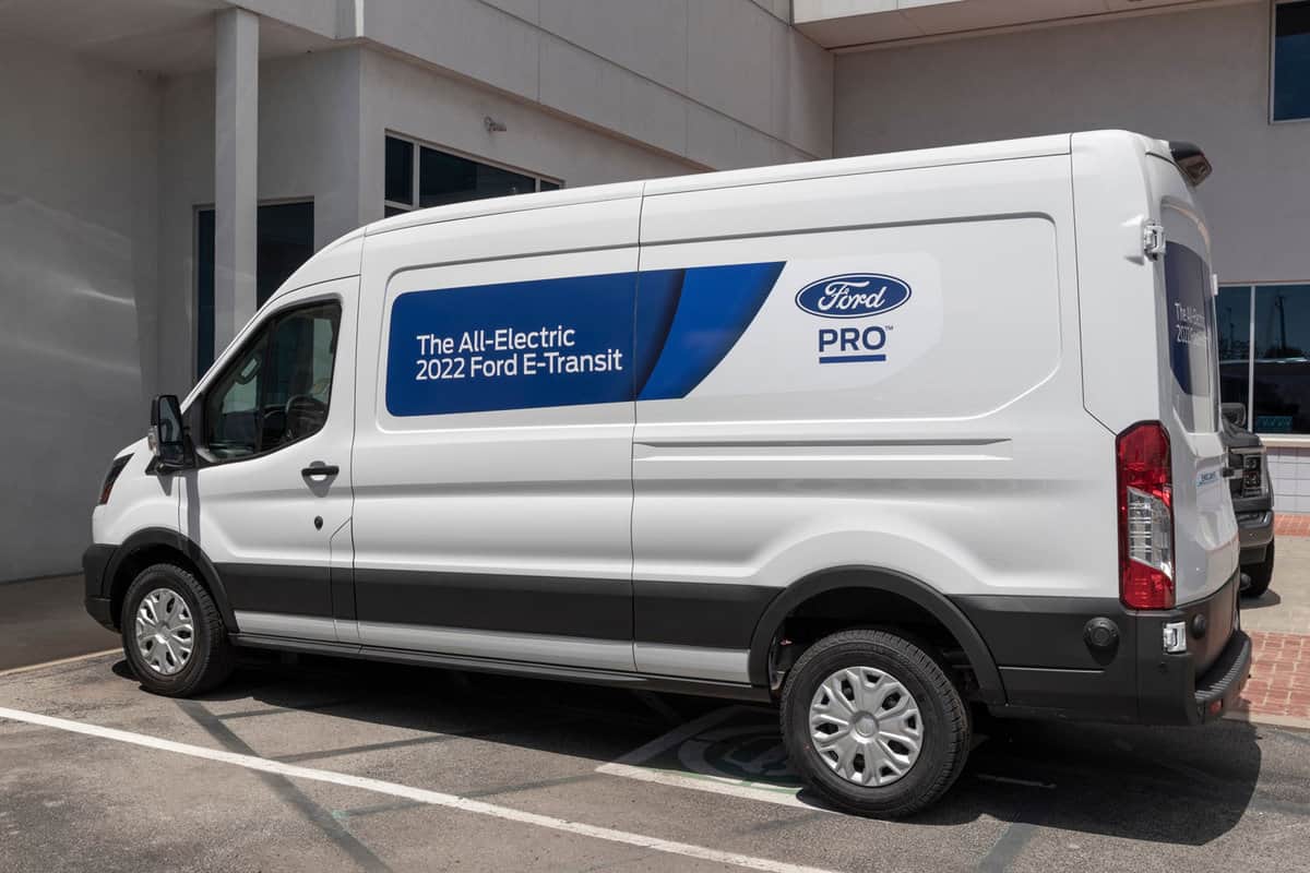 Ford E-Transit Cargo Van display at a dealership. The Ford E-Transit has an electric motor providing 266 horsepower with a maximum payload of 3,880 pounds.