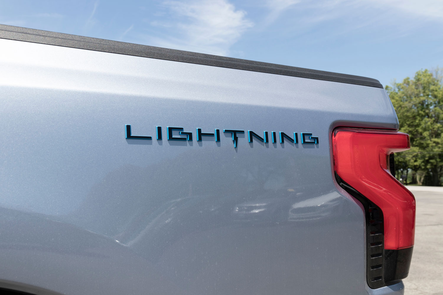 Ford F-150 Lightning display. Ford offers the F150 Lightning all-electric truck in Pro, XLT, Lariat, and Platinum models.
