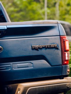 Ford F150 Raptor rear view huge wide tail gate raptor emblem goes off the road trail