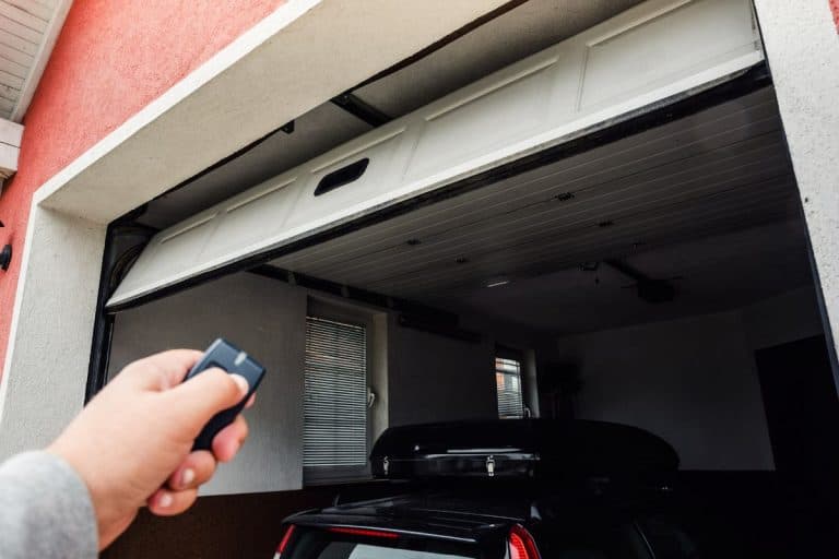 Garage door PVC. Hand use remote controller for closing and opening garage door. - How To Program A Toyota Sienna Garage Door Opener.