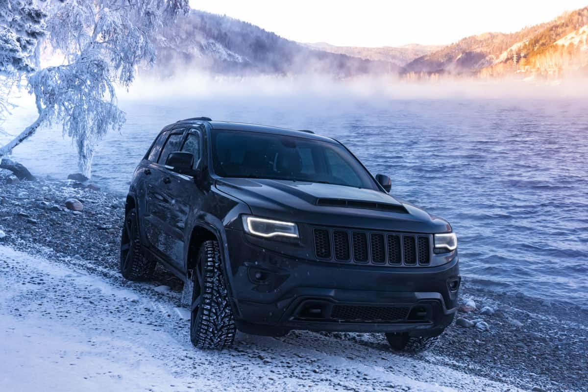 Jeep Cherokee car on the middle of the snow terrain