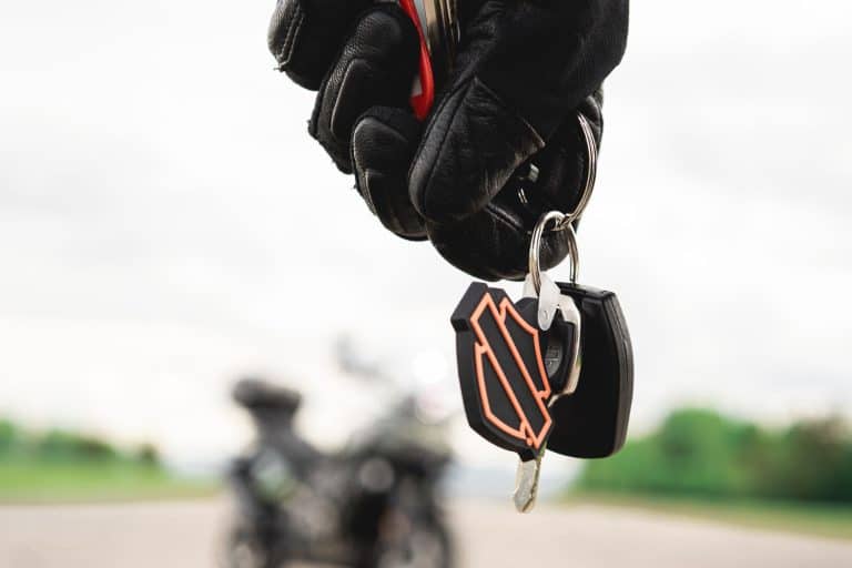Man walking towards harley davidson bike with branded keys, Why Is My Harley Davidson Not Recognizing The Key Fob