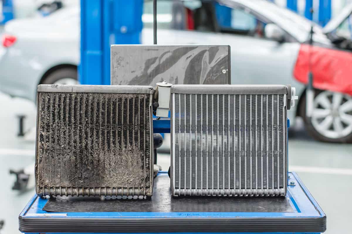 Old and used car evaporator compared to a new one