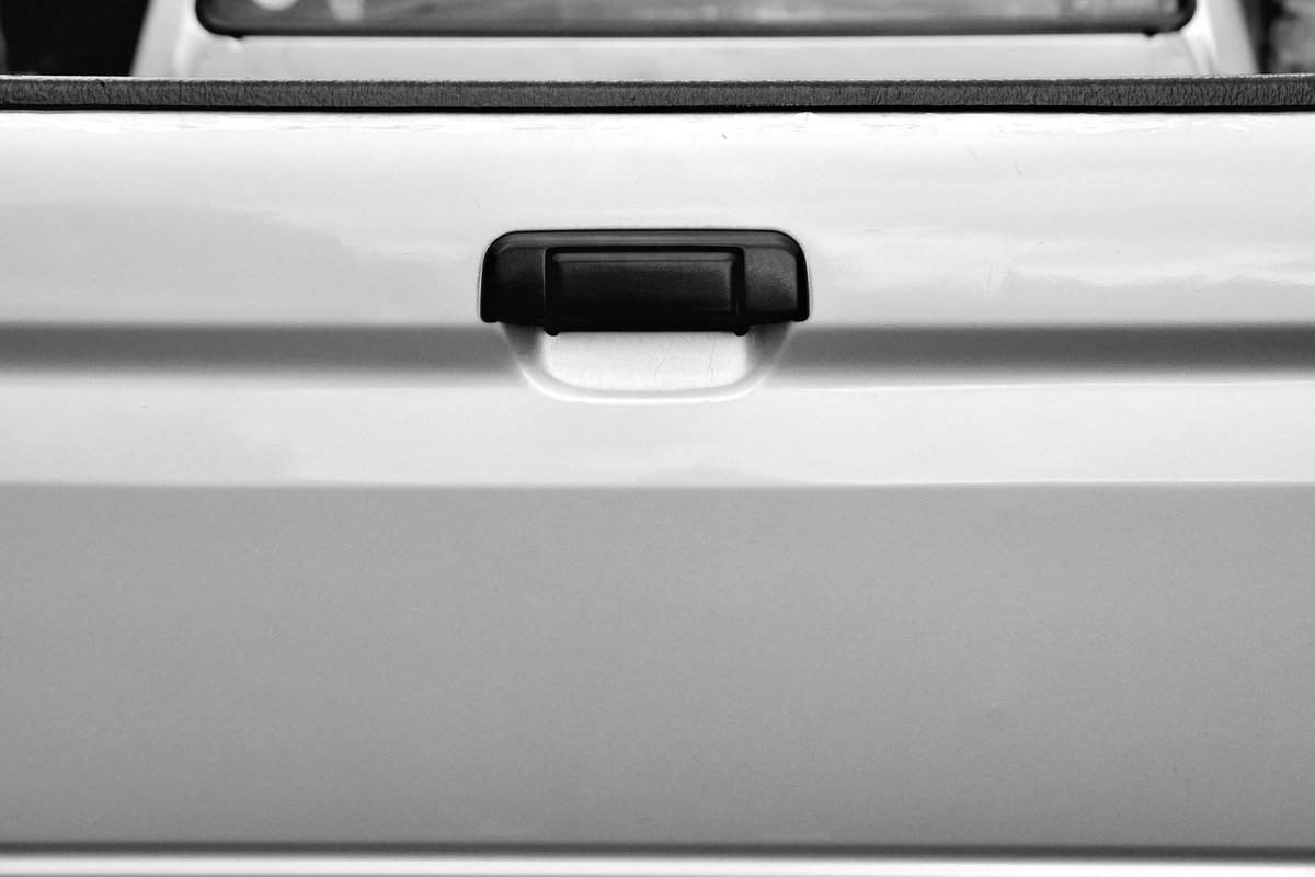 Rear tailgate, Outside Old model of black car door handle 