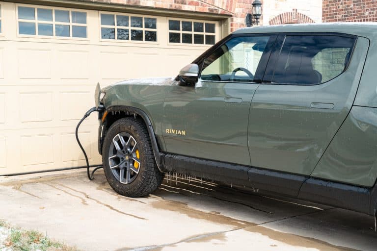Rivian Electric Truck charging at home with ice cycles and snow from winter storm, Can Rivian Power A House?