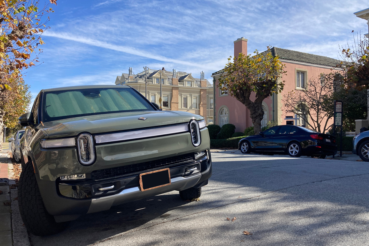 Rivian R1T all-electric, battery-powered, light duty pickup truck parked on the resedential street.