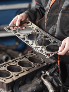 Sealing gasket in hand. The mechanic disassemble block engine vehicle, Head Gasket: Which Side Is Up? What Happens If It Is Installed Backwards?
