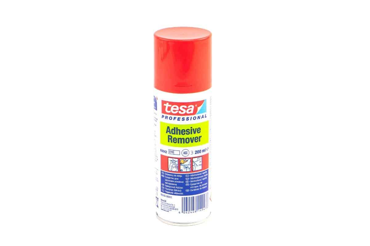 Tesa Professional Adhesive Remover container on isolated background.