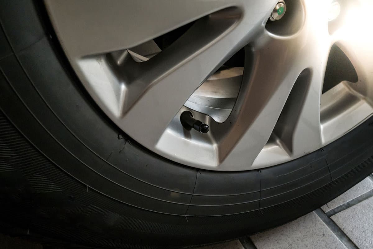 Tire Air Pressure Valve with cap on car wheel. Tire Air Pressure Valve is one of the wheel components. 
